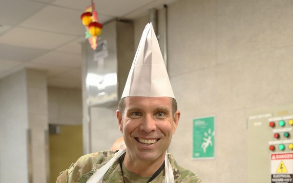Soldiers are served Thanksgiving dinner at Camp Arifjan, Kuwait