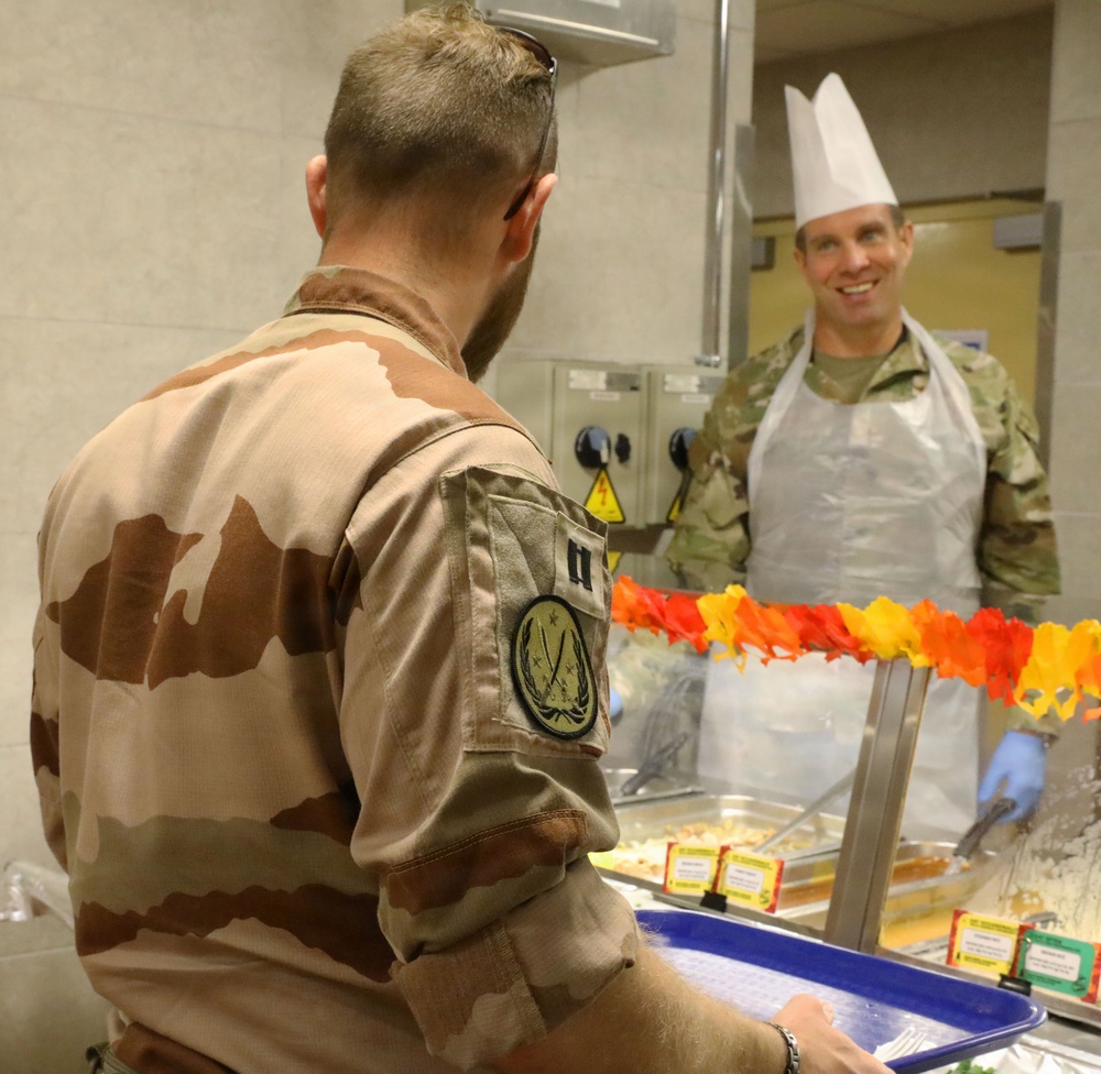 Soldiers are served Thanksgiving dinner at Camp Arifjan, Kuwait