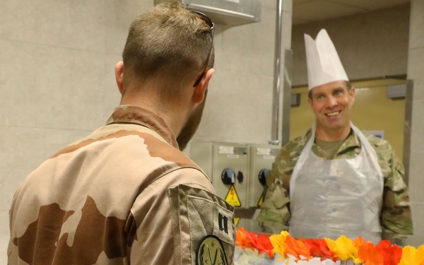 Soldiers are served Thanksgiving dinner at Camp Arifjan, Kuwait