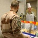 Soldiers are served Thanksgiving dinner at Camp Arifjan, Kuwait