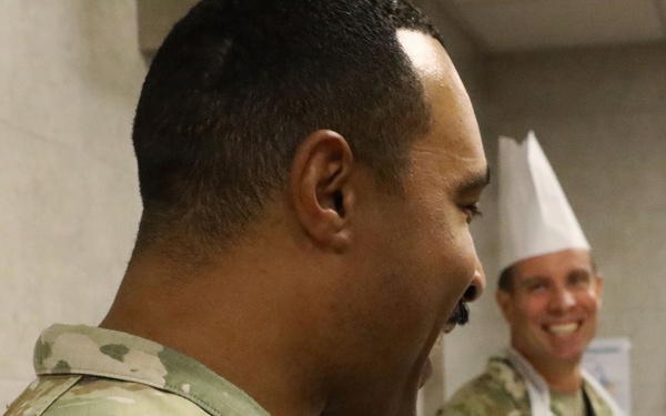 Soldiers are served Thanksgiving dinner at Camp Arifjan, Kuwait