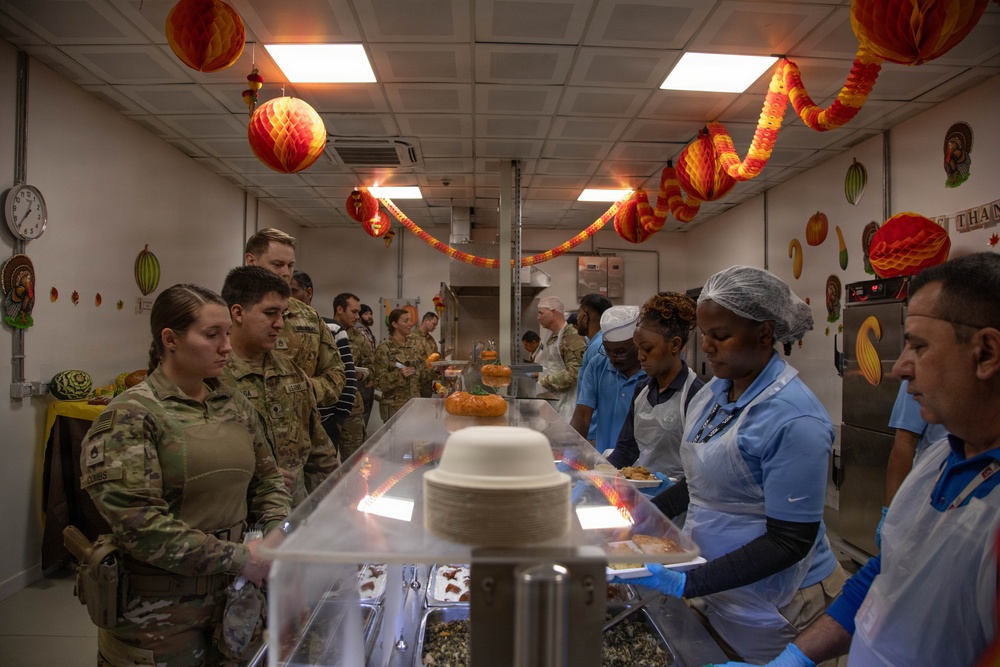 Soldiers are served up a Thanksgiving Meal courtesy of DFACs and Leadership
