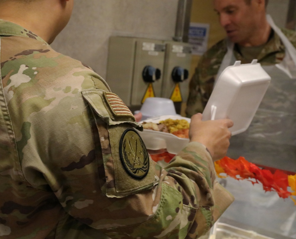 Soldiers are served Thanksgiving dinner at Camp Arifjan, Kuwait