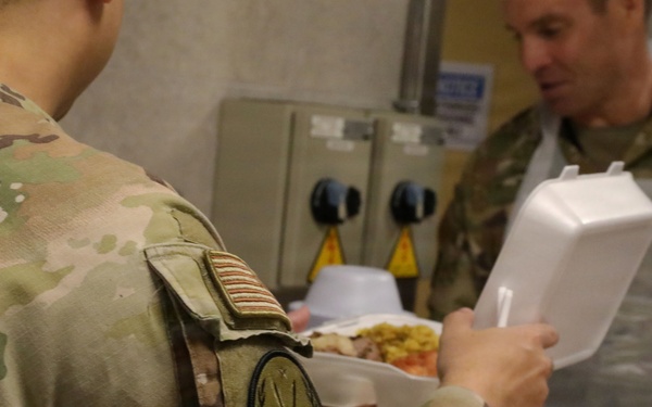 Soldiers are served Thanksgiving dinner at Camp Arifjan, Kuwait