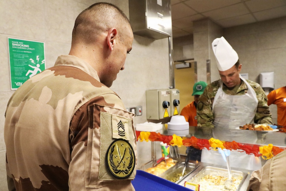 Soldiers are served Thanksgiving dinner at Camp Arifjan, Kuwait