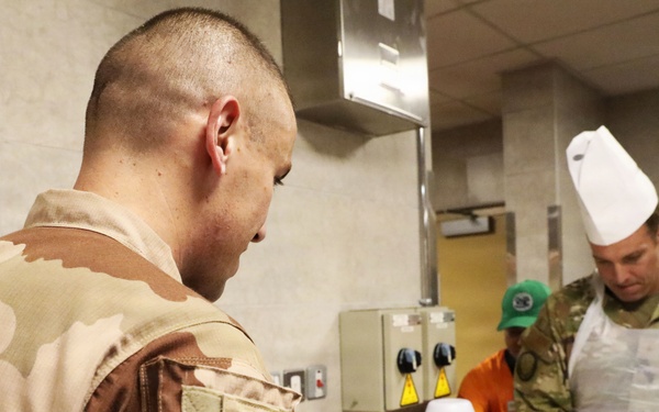 Soldiers are served Thanksgiving dinner at Camp Arifjan, Kuwait