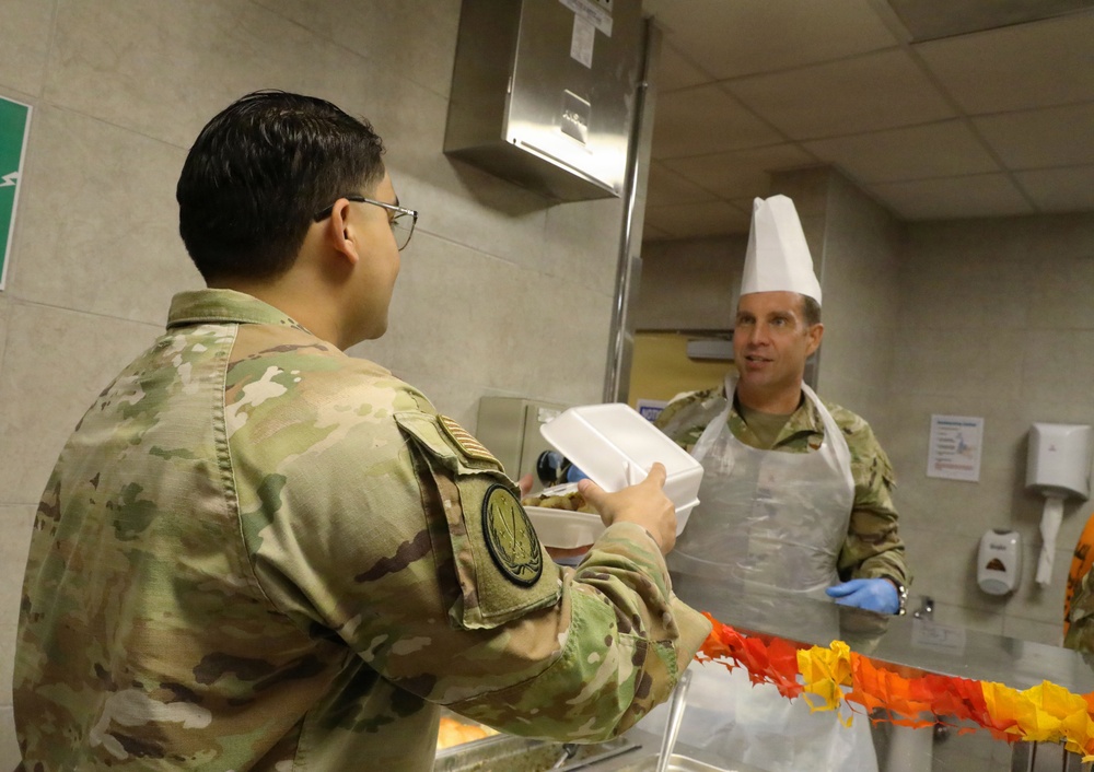Soldiers are served Thanksgiving dinner at Camp Arifjan, Kuwait