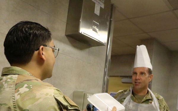 Soldiers are served Thanksgiving dinner at Camp Arifjan, Kuwait