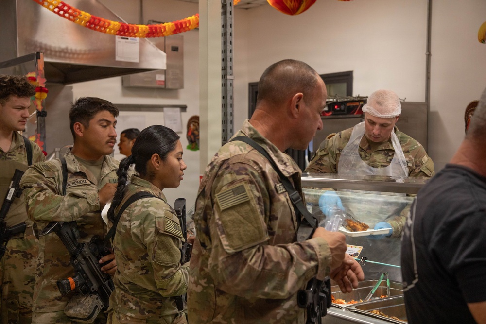 Soldiers are served up a Thanksgiving Meal courtesy of DFACs and Leadership