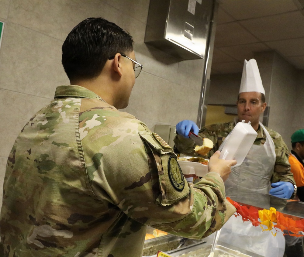 Soldiers are served Thanksgiving dinner at Camp Arifjan, Kuwait