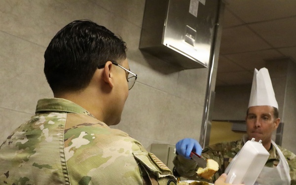 Soldiers are served Thanksgiving dinner at Camp Arifjan, Kuwait