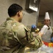Soldiers are served Thanksgiving dinner at Camp Arifjan, Kuwait