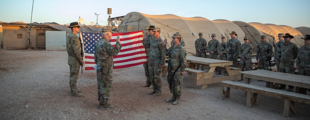 Brig. Gen. Kevin J. Lambert re-enlists two soldiers