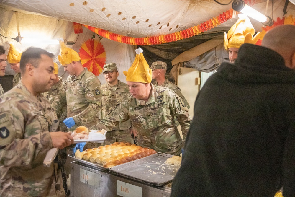 Brig. Gen. Kevin J. Lambert serves food to soldiers at Al-Tanf Garrison