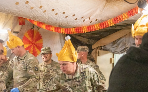 Brig. Gen. Kevin J. Lambert serves food to soldiers at Al-Tanf Garrison