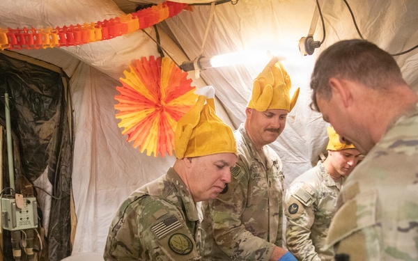 Brig. Gen. Kevin J. Lambert serves food to soldiers at Al-Tanf Garrison