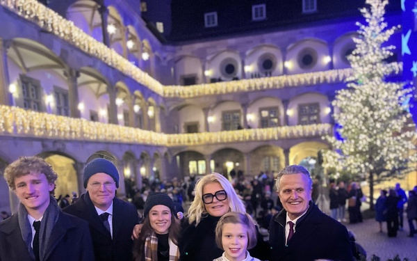 USAG Stuttgart Commander Col. Edward Sanford, joined by his wife and son, attends the opening of the Stuttgart Christmas Market on Nov. 26, 2025.