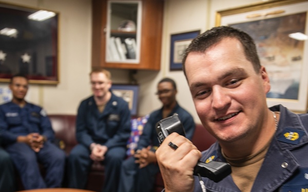USS Mitscher (DDG 57) Sailor speaks on phone with U.S. Chief of Naval Operations