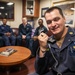 USS Mitscher (DDG 57) Sailor speaks on phone with U.S. Chief of Naval Operations