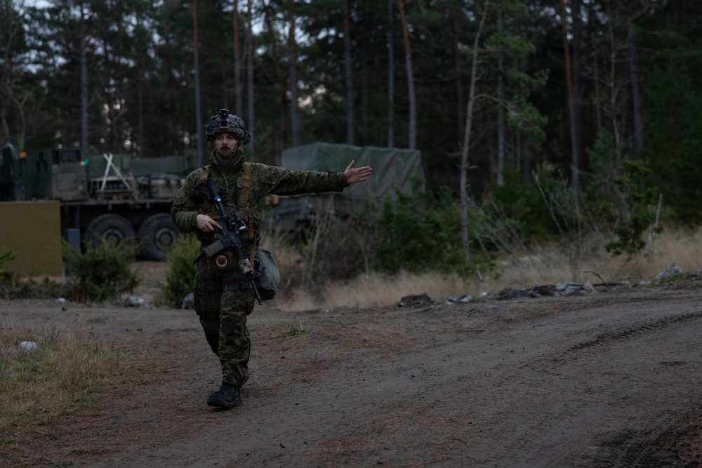 U.S. Marines establish a secured area during a bilateral exercise while deployed in the Baltic sea