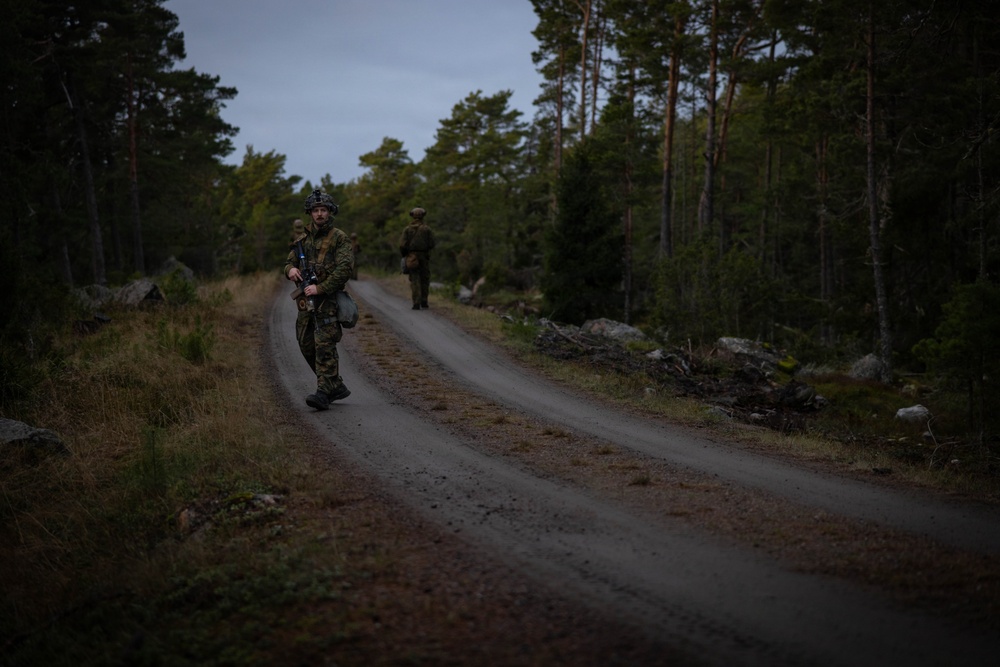 U.S. Marines establish a secured area during a bilateral exercise while deployed in the Baltic sea