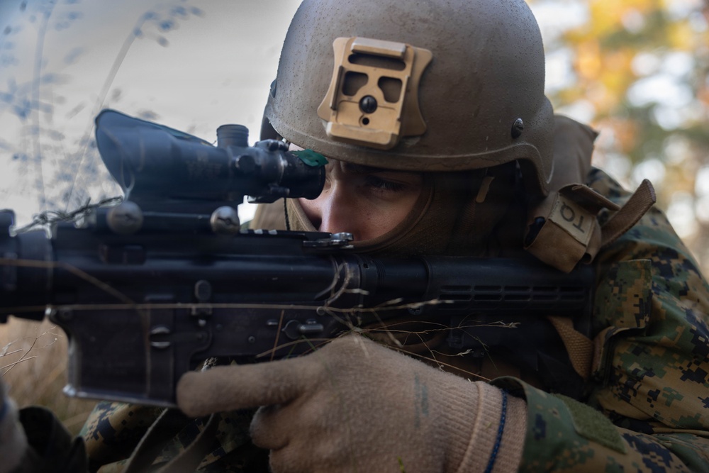 U.S. Marines establish a secured area during a bilateral exercise while deployed in the Baltic sea