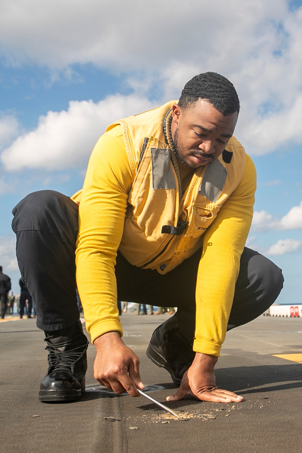 USS Tripoli Preforms FOD Walk Down