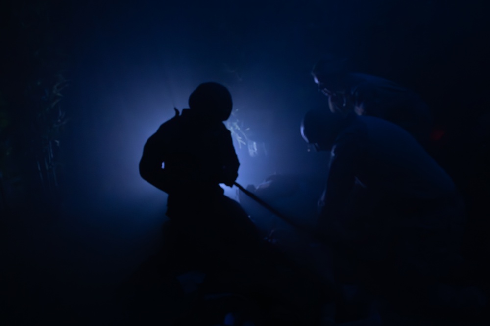 U.S. Navy Hospital Corpsman participate in the culminating event of a Combat Medical Course