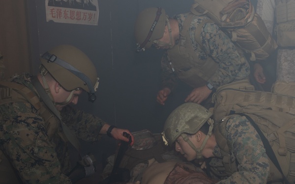 U.S. Navy Hospital Corpsman participate in the culminating event of a Combat Medical Course