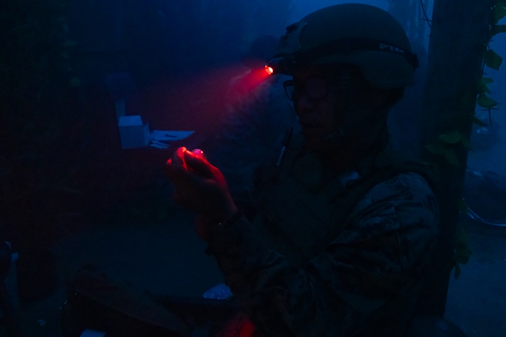 U.S. Navy Hospital Corpsman participate in the culminating event of a Combat Medical Course