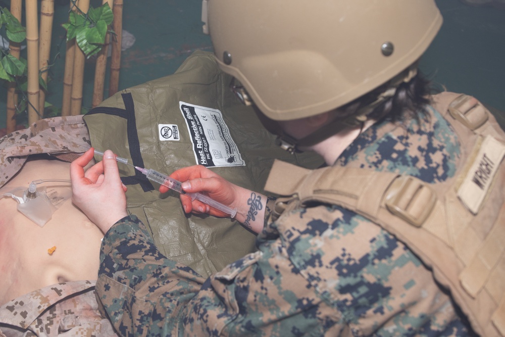 U.S. Navy Hospital Corpsman participate in the culminating event of a Combat Medical Course