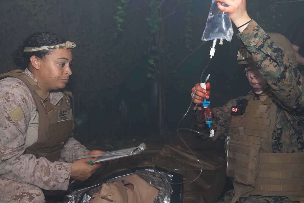 U.S. Navy Hospital Corpsman participate in the culminating event of a Combat Medical Course