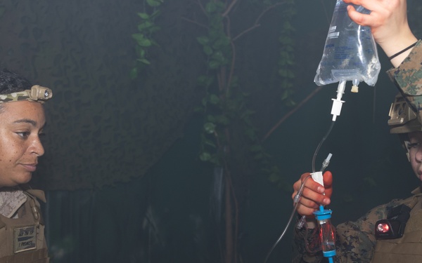 U.S. Navy Hospital Corpsman participate in the culminating event of a Combat Medical Course