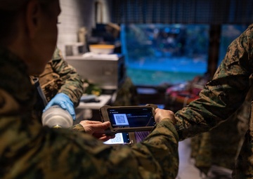 U.S. Sailors use battlefield assisted trauma documentation kit for simulated casualty during European deployment