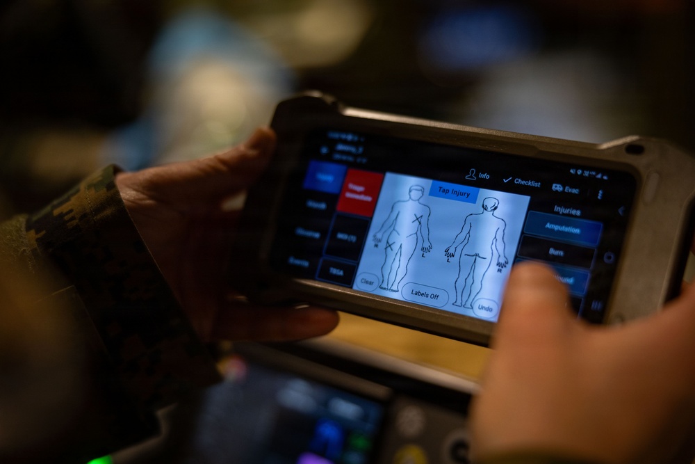 U.S. Sailors use battlefield assisted trauma documentation kit for simulated casualty during European deployment