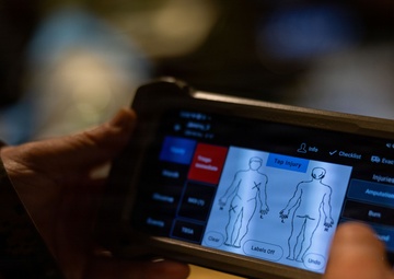 U.S. Sailors use battlefield assisted trauma documentation kit for simulated casualty during European deployment