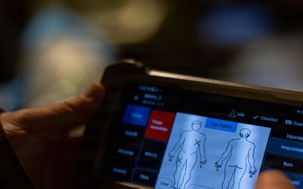 U.S. Sailors use battlefield assisted trauma documentation kit for simulated casualty during European deployment