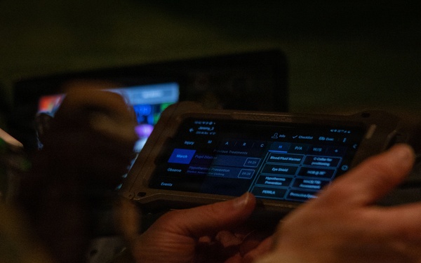 U.S. Sailors use battlefield assisted trauma documentation kit for simulated casualty during European deployment