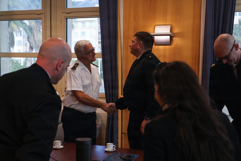 Cmdr. Joseph Phillips, commanding officer, USS Paul Ignatius (DDG 117) meets with French Navy Rear Adm. Vincent Gregoire and Capt. Pierre Suleau
