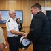 Cmdr. Joseph Phillips, commanding officer, USS Paul Ignatius (DDG 117) meets with French Navy Rear Adm. Vincent Gregoire and Capt. Pierre Suleau