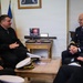 Cmdr. Joseph Phillips, commanding officer, USS Paul Ignatius (DDG 117) meets with French Navy Rear Adm. Vincent Gregoire and Capt. Pierre Suleau
