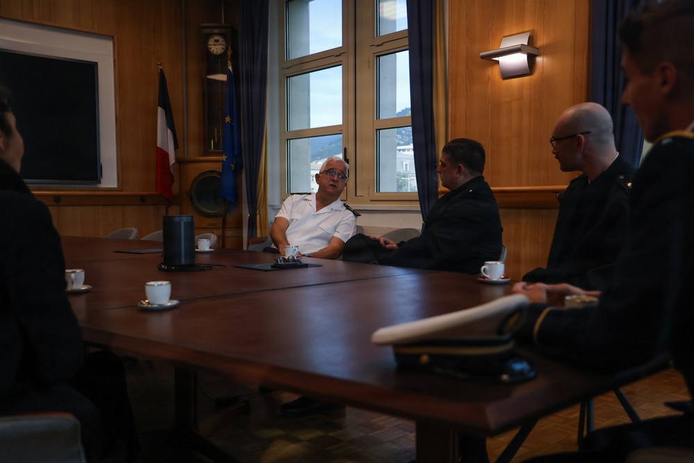 Cmdr. Joseph Phillips, commanding officer, USS Paul Ignatius (DDG 117) meets with French Navy Rear Adm. Vincent Gregoire and Capt. Pierre Suleau