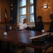 Cmdr. Joseph Phillips, commanding officer, USS Paul Ignatius (DDG 117) meets with French Navy Rear Adm. Vincent Gregoire and Capt. Pierre Suleau