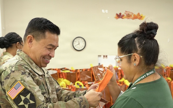 Chaplain hands out holiday meal bags