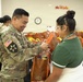 Chaplain hands out holiday meal bags