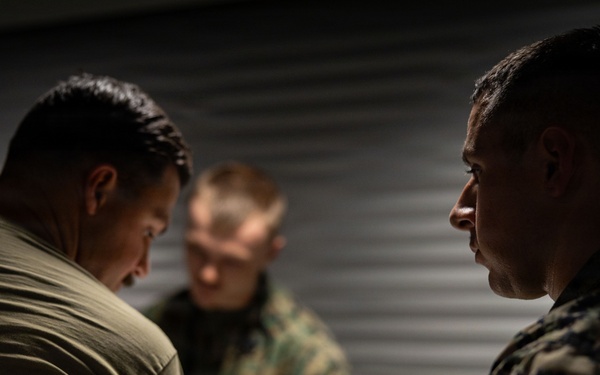U.S. Navy Sailors suture a Finnish service member’s facial laceration