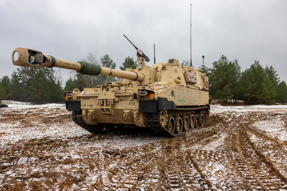 U.S. Soldiers set up firing positions with a M109A7 Paladin Self-Propelled Howitzer