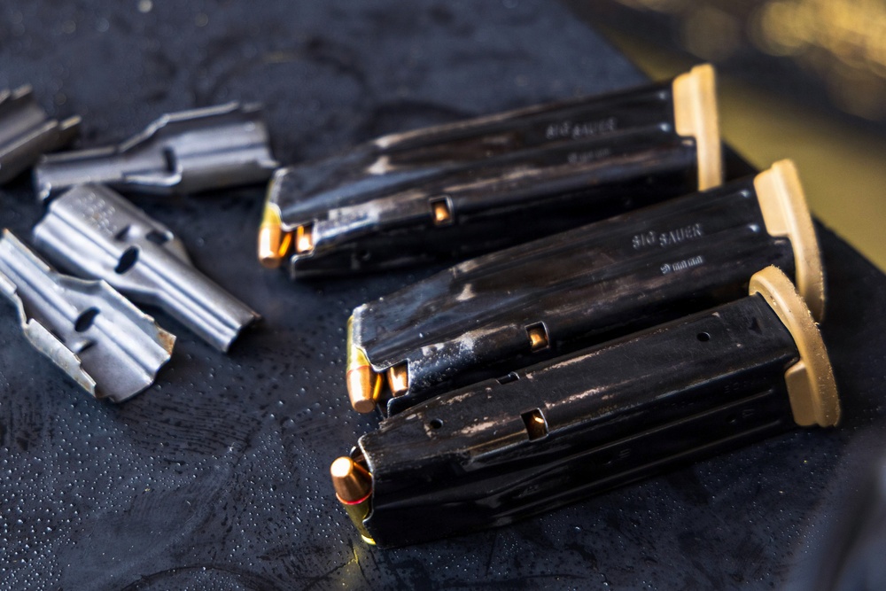 Reconnaissance Marines with the 24th Marine Expeditionary Unit conduct pistol and rifle shooting drills as a part of a modified qualification for Close Quarters Tactics training.