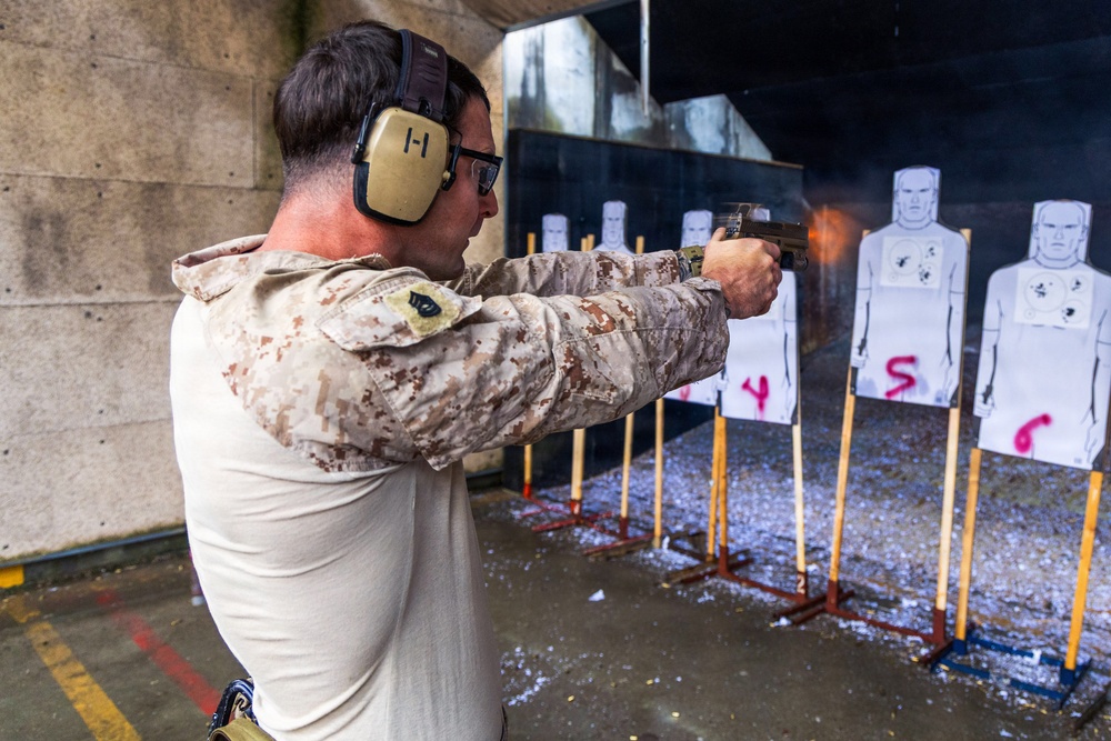Reconnaissance Marines with the 24th Marine Expeditionary Unit conduct pistol and rifle shooting drills as a part of a modified qualification for Close Quarters Tactics training.