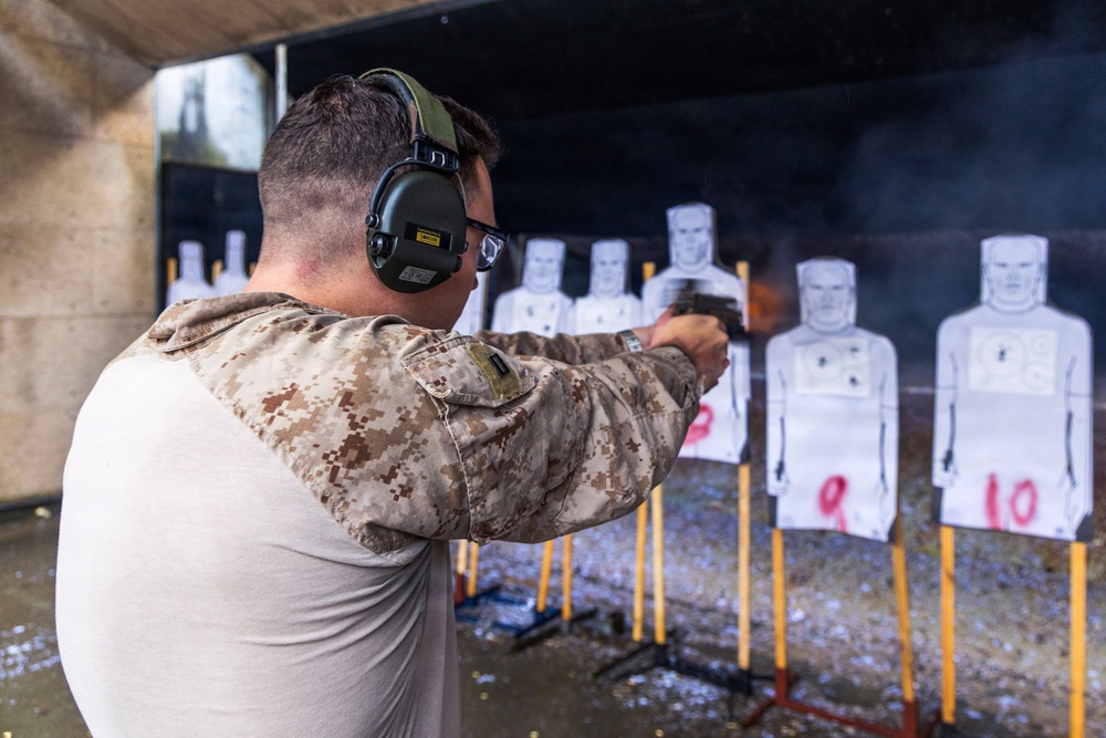 Reconnaissance Marines with the 24th Marine Expeditionary Unit conduct pistol and rifle shooting drills as a part of a modified qualification for Close Quarters Tactics training.